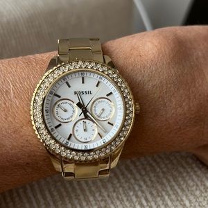 Fossil gold watch with pave “diamond” face.